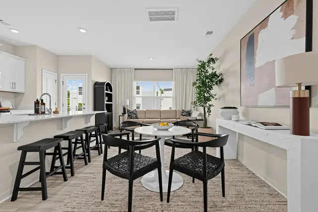Maywood dining area between the kitchen and living room