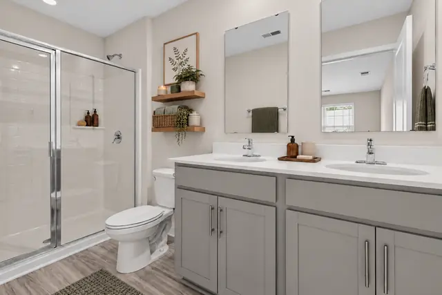Pearson primary bathroom with double vanity and walk-in shower
